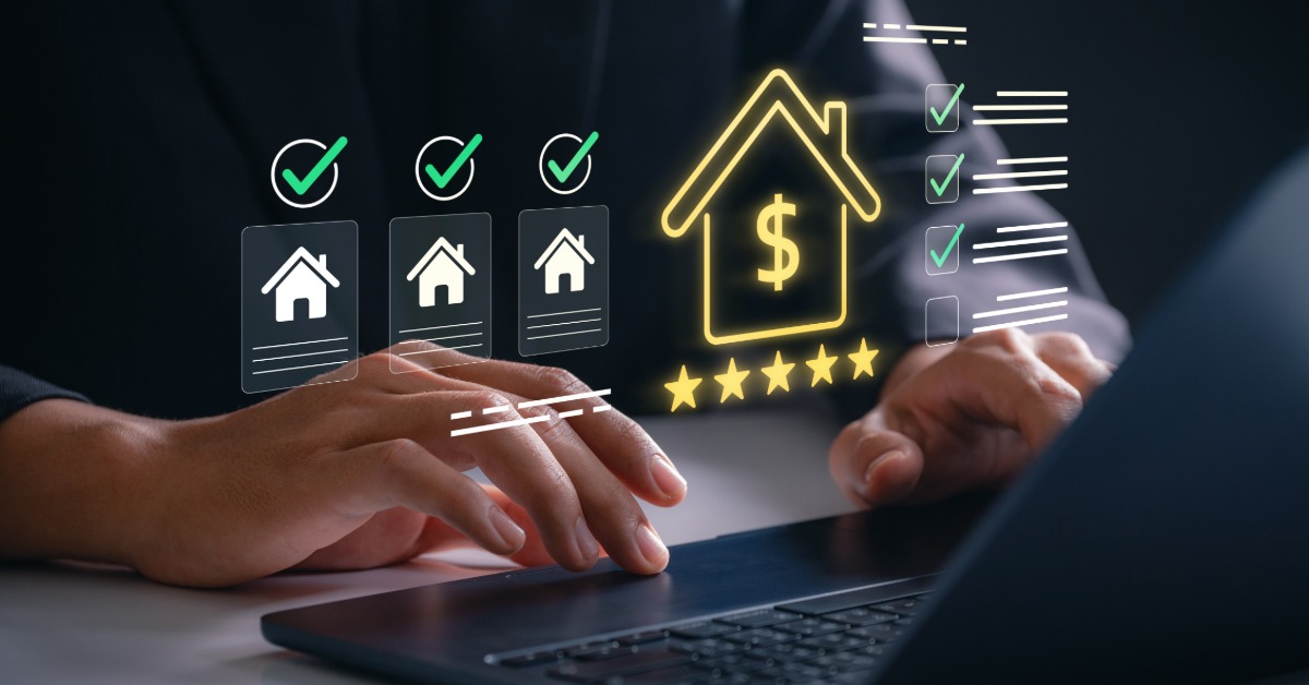 A close-up of two hands typing on a laptop with digital images of a house, checkmarks, and stars floating in front.